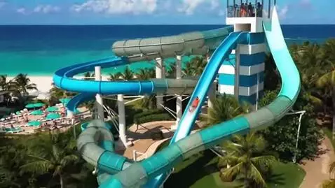 AI Video from prompt: Make a video resort slides   connects to sky to 