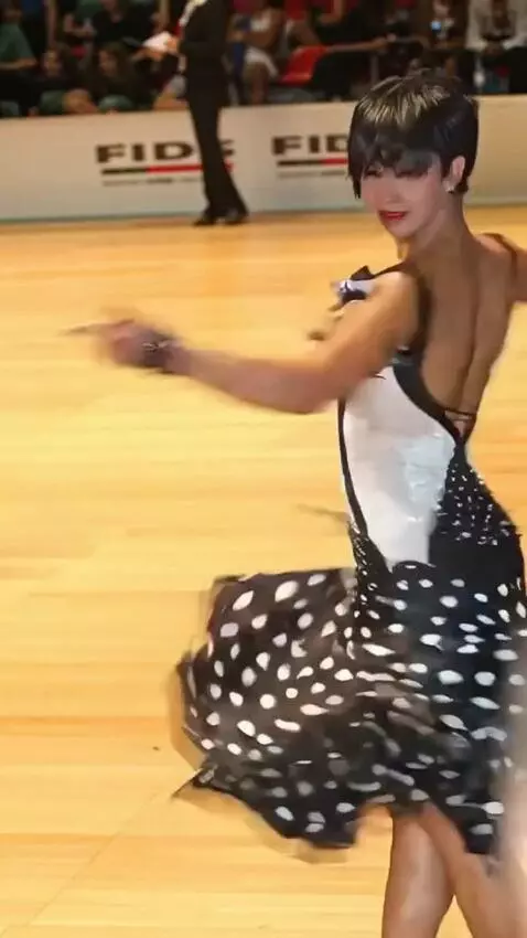 AI Video from prompt: The athlete is dancing the jive, turning her bac