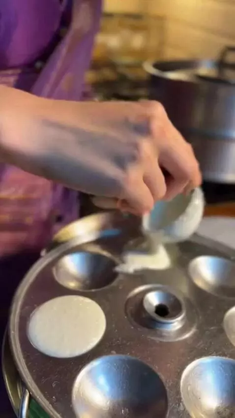 AI Video from prompt: She's an Indian girl cooking with the traditiona