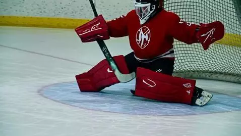 AI Video from prompt: Slow motion shot of a hockey puck hitting the ba