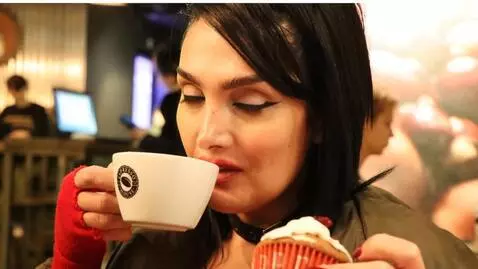 AI Video from prompt: woman drinking coffee from her mug