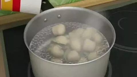 AI Video from prompt: He takes dumplings with the Russian name Yermoli