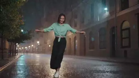 AI Video from prompt: A girl dancing in a rain