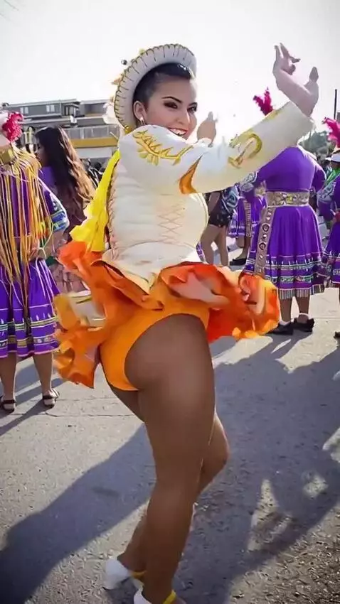 AI Video from prompt: The girl is dancing jazz; her muscular legs are 