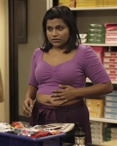 AI Video from prompt: A snooty Indian-American office worker is standi