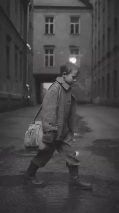 AI Video from prompt: Clip 1: A 10–12‑year‑old boy in worn, tattered c