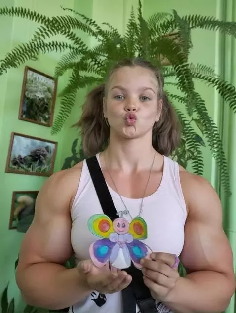 AI Video from prompt: This person is a 210 cm tall heavy muscular fema