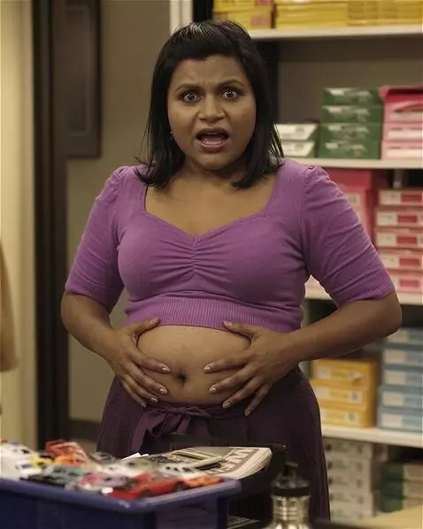 AI Video from prompt: A snooty Indian-American office worker is standi