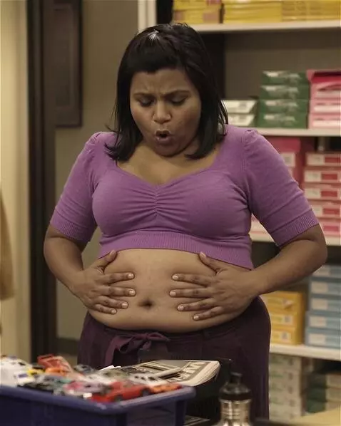 AI Video from prompt: A snooty Indian-American office worker is standi