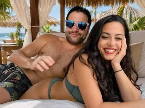 AI Video from prompt: He strokes her back. She smiles.