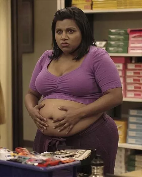 AI Video from prompt: A snooty Indian-American office worker is standi