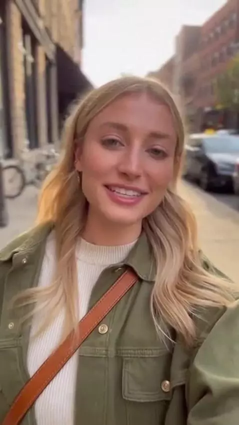 AI Video from prompt: A cute early 20s, blonde woman , standing in str