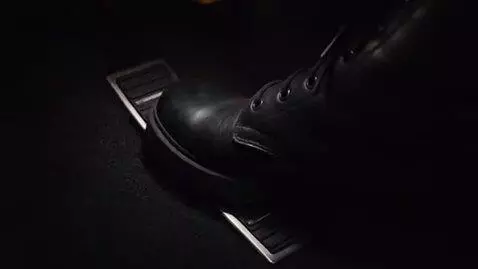 AI Video from prompt: Create a TV action scene of this character drivi