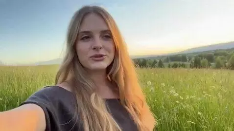 AI Video from prompt: Girl in grass setting vlog style