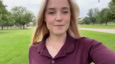 AI Video from prompt: Girl in park grassy setting vlog style