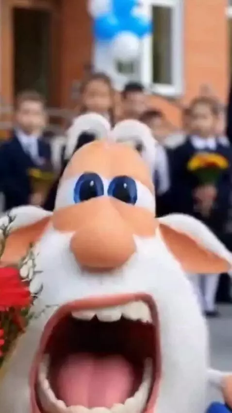 AI Video from prompt: Bouba is standing at a school assembly in front 