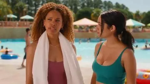 AI Video from prompt: Two young women were talking at a water park; up