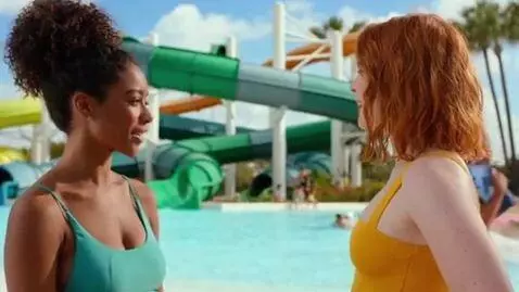 AI Video from prompt: Two young women were talking at a water park; up