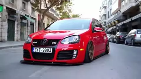 AI Video from prompt: Make a golf 5 gti red tuned in Athens going to p