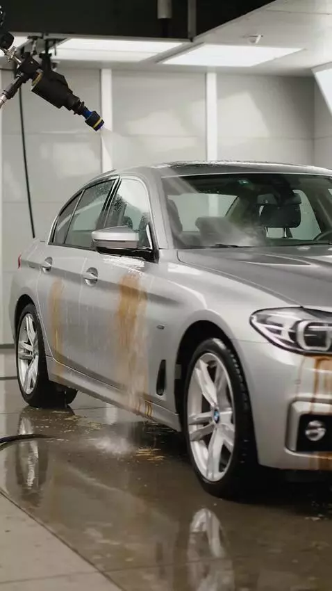 AI Video from prompt: The entire BMW exterior is thoroughly washed wit