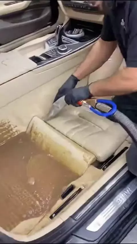 AI Video from prompt: The BMW doors are opened and the heavily mud-con