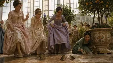 AI Video from prompt: The ladies are trying to evade the hopping frogs