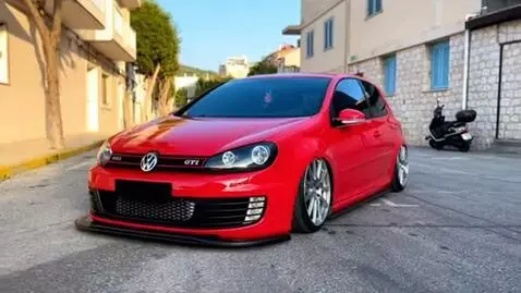AI Video from prompt: Make in Chalkida Greece a golf 5 gti tuned red g