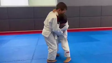 AI Video from prompt: two boys at six years,wearing bjj jackets,white 