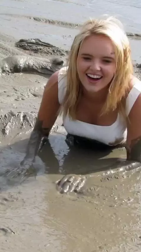 AI Video from prompt: The woman falls into the dirt and tries to crawl