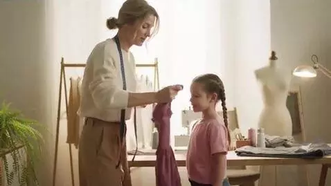 AI Video from prompt: Woman shrinks dress to fit her daughter it
