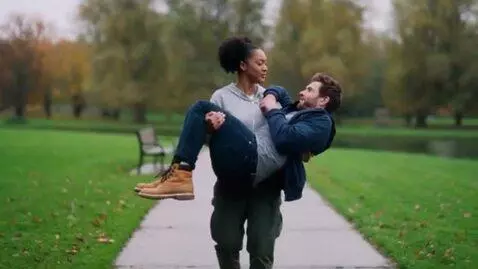 AI Video from prompt: woman lifting man in her arms