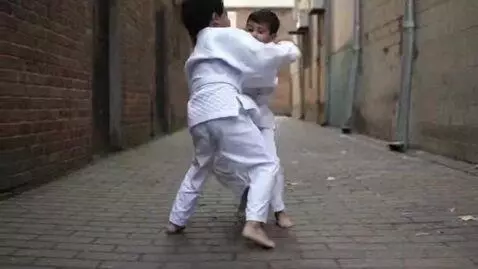 AI Video from prompt: two boys at six years,wearing bjj jackets,white 