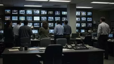 AI Video from prompt: Picture: Backs to us. One producer takes half a 