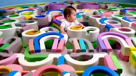 AI Video from prompt: Cute baby girl navigating a maze and emerging vi