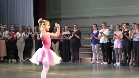 AI Video from prompt: Bouncing baby girl dancing at a ballet with peop