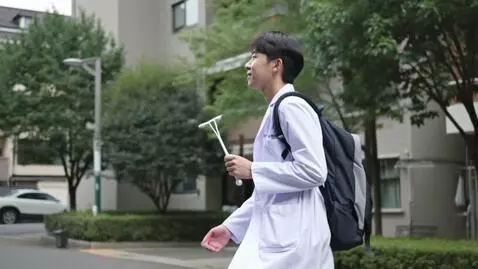 AI Video from prompt: A medical student returning to his hostel with h