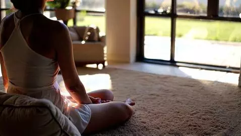 AI Video from prompt: Morning meditation of a lady sitting in her open