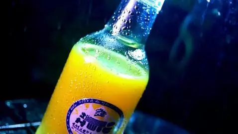 AI Video from prompt: Joy fanta drink, in a wet bottle with water drip