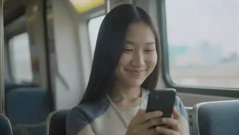 AI Video from prompt: A girl reading something on her mobile, subtle s