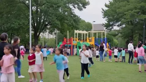 AI Video from prompt: Playground with lots of people and kids