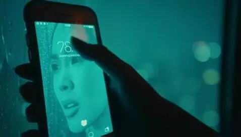 AI Video from prompt: "Dark, intimate close-up of a trembling hand hol