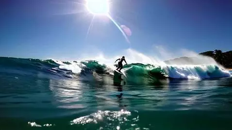 AI Video from prompt: Surfing a big wave in Hawaii