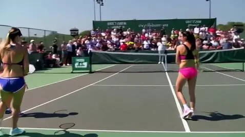 AI Video from prompt: Two women wearing colourful bikinis and playing 