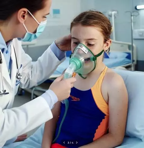 AI Video from prompt: Doctor giving swimmer girl oxygen mask and helpi