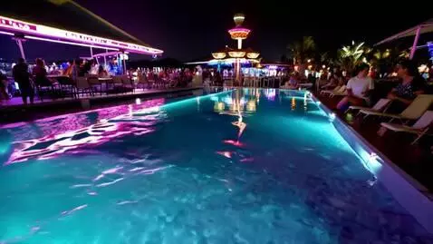 AI Video from prompt: Infinity pool beside a nightclub