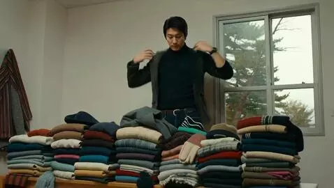AI Video from prompt: a man is wearing the most clothes anyone has eve
