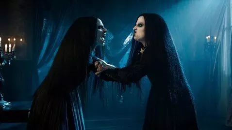 AI Video from prompt: two goth twins angrily bumping boobs while cursi