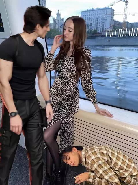 AI Video from prompt: while the guy in black is kissing the girl in th