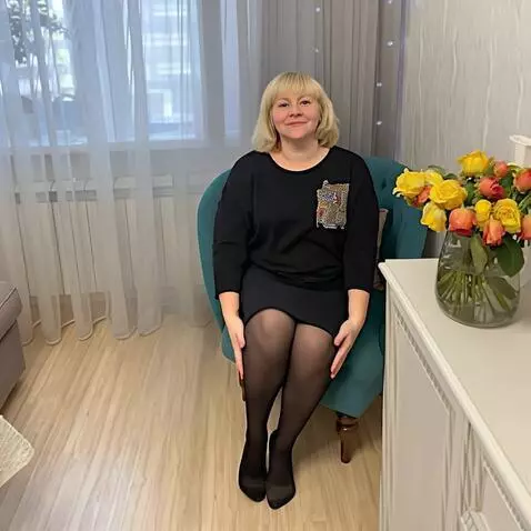 AI Video from prompt: a woman in tights lifts her legs up and holds th