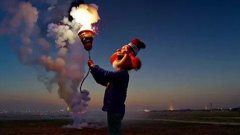 AI Video from prompt: Freedom Granda lighting off s comically huge fir